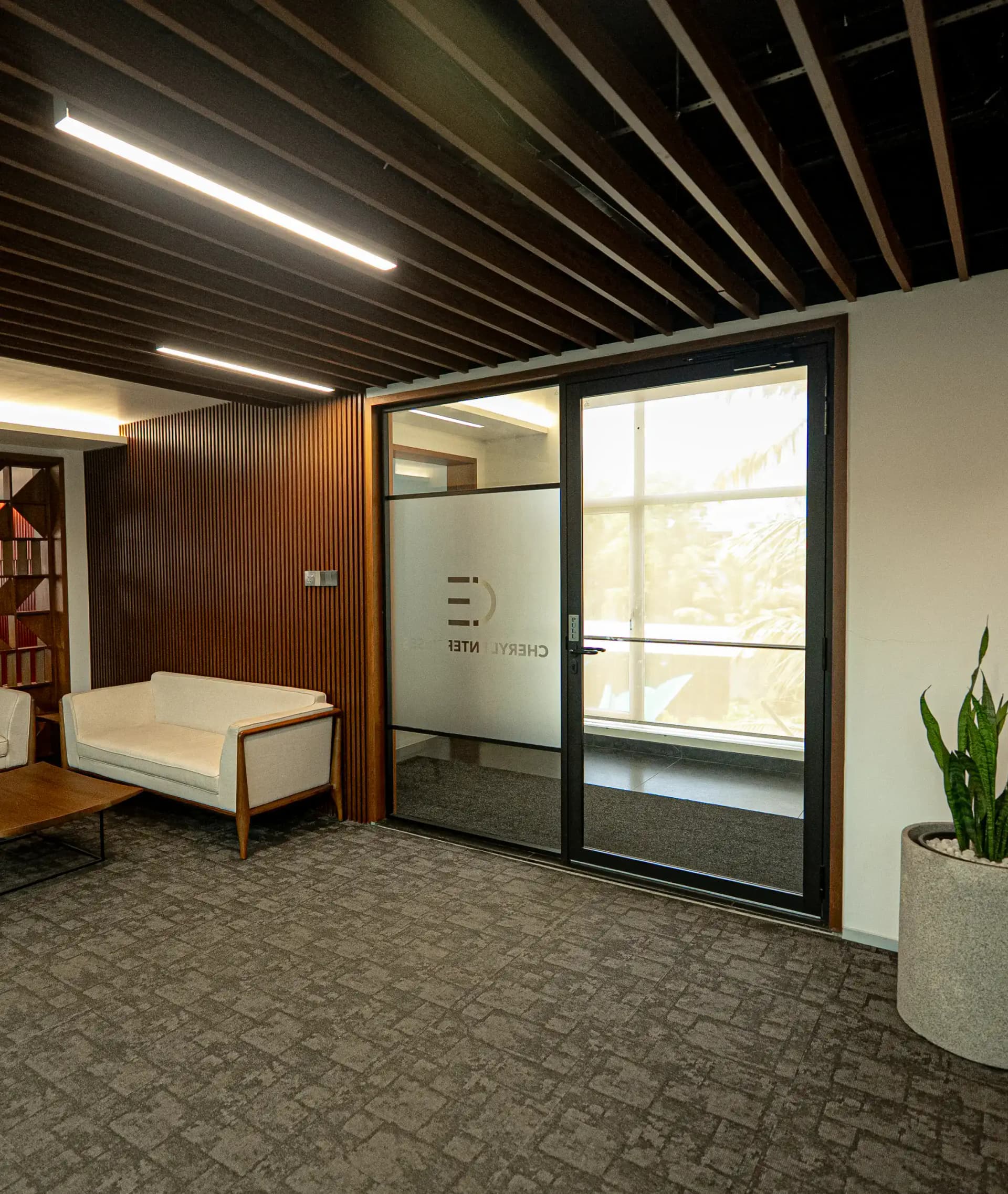 Modern office entry with glass door
