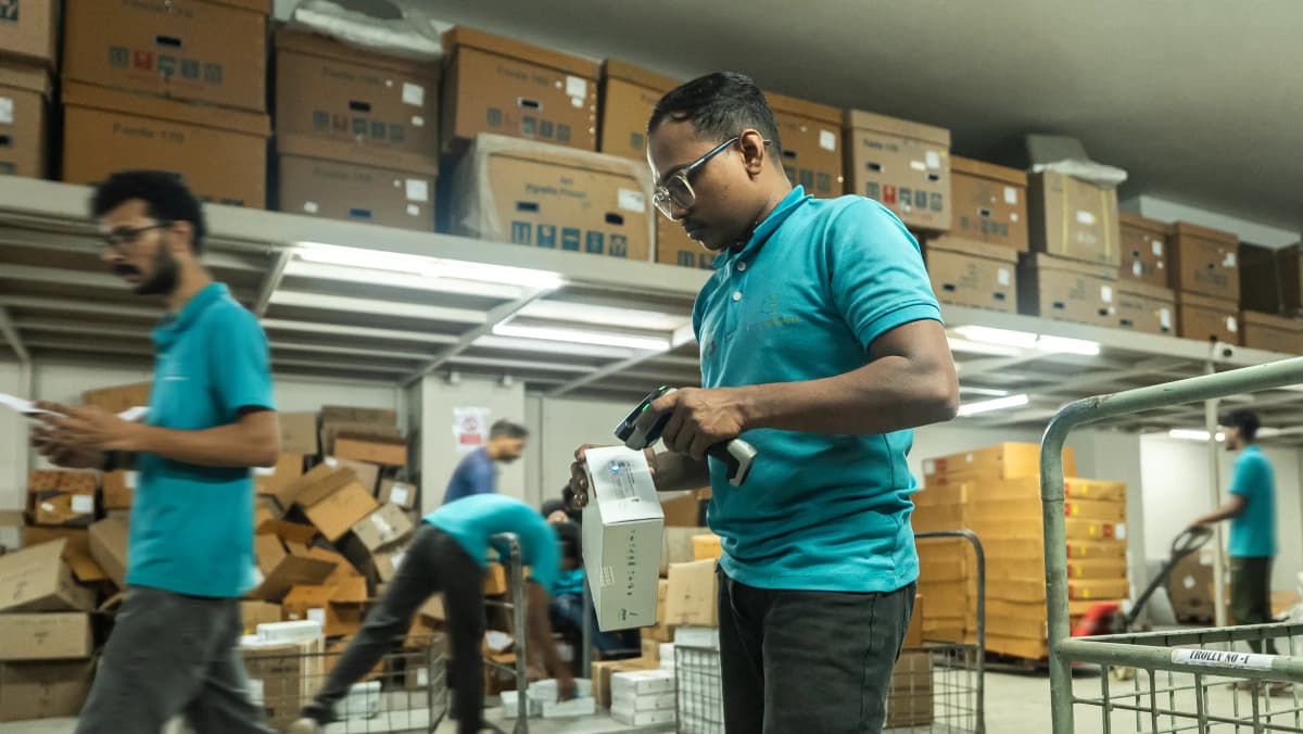 Warehouse worker scanning packages